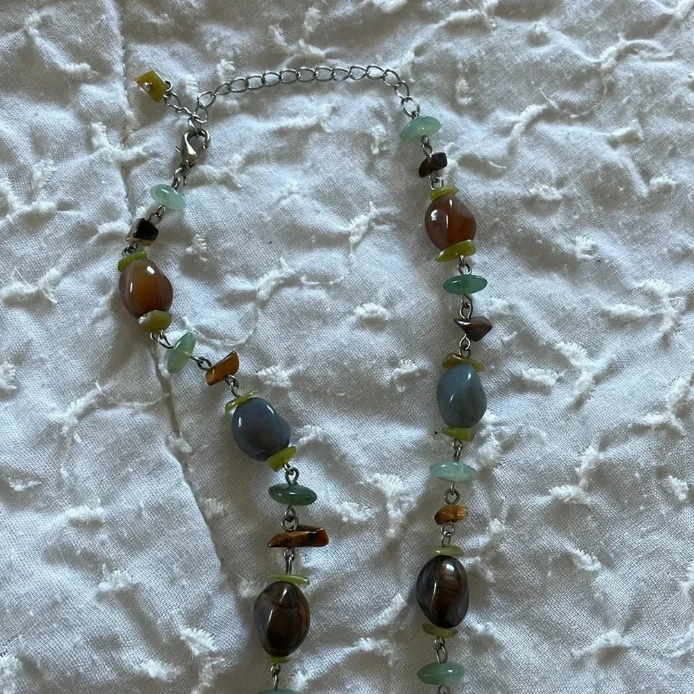 Beautiful necklace. Gray, brown and light aqua stones with silver tone accents.